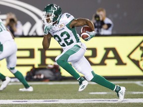 Saskatchewan Roughriders' Christion Jones runs the ball for a touchdown during second half CFL football action against the Hamilton Tiger-Cats, in Hamilton, Ont., Thursday July 19, 2018.