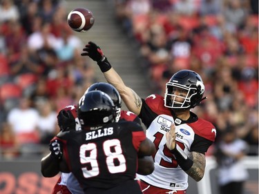 Calgary Stampeders quarterback Bo Levi Mitchell (19) throws the ball against the Ottawa Redblacks during first half CFL action in Ottawa on Thursday, July 12, 2018.