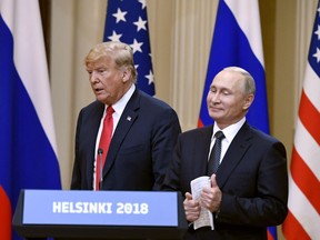 U.S. President Donald Trump and Russian President Vladimir Putin arrive during a join press conference at the Presidential Palace in Helsinki, Finland, Monday, July 16, 2018.