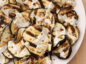 Grilled eggplant with yogurt sauce. This recipe appears in the cookbook "The Complete Mediterranean Cookbook."