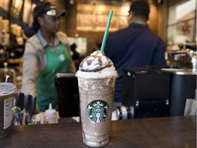 A Venti Mocha Frappuccino is displayed at a Starbucks, Wednesday, June 20, 2018, in New York. The 24 fluid ounces drink has 520 calories, according to Starbucks. Starbucks says sales for its frozen coffee drink are down, and is blaming concerns about sugar and calories.
