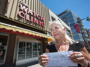 Bank Street business owner Vivian Schenker of The Watch Clinic is frustrated with the city after she was ordered to remove some graffiti from a hard-to-reach part of her building.
