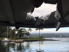 This photo provided by the Hawaii Department of Land and Natural Resources shows damage to the roof of a tour boat after an explosion sent lava flying through the roof off the Big Island of Hawaii Monday, July 16, 2018, injuring at least 23 people.