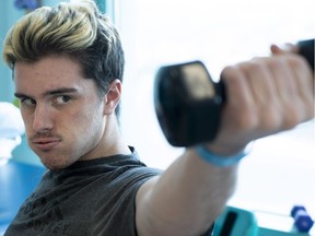 Humboldt Broncos survivor Ryan Straschnitzki does muscles strengthening exercises.