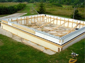 This insulated concrete form (ICF) foundation sits directly on bedrock. The space within the foundation will be filled later with compacted aggregate before a concrete floor is poured.