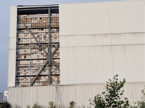 Hundreds of file boxes are exposed after a section of metal wall on the Iron Mountain secure storage warehouse Kenaston Street  in Ottawa was torn off by high winds on Monday.