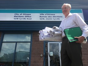 Clive Doucet at the city elections office on Cyrville Road registered to run for mayor on Friday. Jon Willing/Postmedia