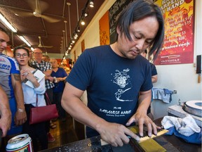 Takayukui Shibata sharpens a knife during a demonstration on Thursday, July 19, 2018.