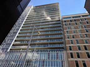 Smoke is visible from a 14th floor apartment at 324 Laurier Ave. W. Saturday, July 7.