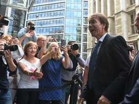 Singer Cliff Richard arrives at the Rolls Building to hear the ruling of his case against the BBC over coverage of a South Yorkshire Police raid in August 2014 on his home in Sunningdale, Berkshire following a child sex assault allegation, Wednesday July 18, 2018, in London.