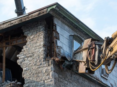 The initial stage of demolition for the Magee House begun on Friday night with crews taking down the south west corner of the building hoping that would be enough to make the building stable enough and the street could be opened to traffic. No decision has been made on whether restoration is a solution or complete demolition.   Photo by Wayne Cuddington/ Postmedia