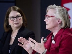 Carolyn Bennett, minister of Crown-Indigenous relations and northern affairs, speaks as she is joined by Jane Philpott, minister of Indigenous services, left, during a press conference in Ottawa on Tuesday, June 5, 2018.