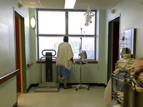 A patient looks out a window at the palliative care unit at St Mary's Hospital Centre in Montreal, Tuesday Dec. 22, 2015.