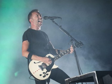 Lead singer Tim McIlrath from Rise Against performs on the City Stage of RBC Ottawa Bluesfest on Sunday night.