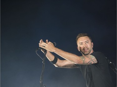 Lead singer Tim McIlrath from Rise Against performs on the City Stage of RBC Ottawa Bluesfest on Sunday night.