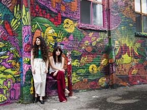 Toronto-based sisters and music duo behind the pop group 'LOLAA', Lex Valentine, right, and Nadia Valerie King pose for a photograph in Toronto on Wednesday, June 13, 2018.