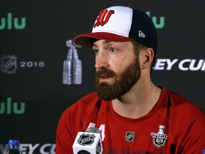 FILE - In this June 3, 2018, file photo, Washington Capitals defenseman Brooks Orpik speaks to the media at Kettler Capitals Iceplex in Arlington, Va. The Washington Capitals are bringing back veteran defenseman Brooks Orpik. The Capitals on Tuesday, July 24, 2018, signed Orpik to a $1 million, one-year contract with $500,000 in performance bonuses. General manager Brian MacLellan announced the signing about a month after trading Orpik to Colorado in a salary-cap clearing move.