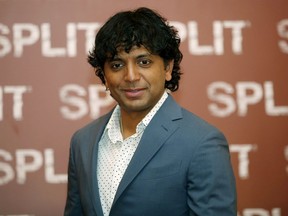 FILE- In this Jan. 11, 2017 file photo, director M. Night Shyamalan poses during a photo call for the movie "Split" in Milan, Italy, Shyamalan says he could have launched the trailer for "Glass" in front of the summer's biggest movies in theaters, but that he wanted to hold it for Comic-Con. The filmmaker said Friday, July 20, 2018, at the annual comic book convention that he felt strongly that the Hall H audience should be the first to see it.