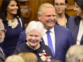 Ontario Premier Doug Ford, right, and Lt.-Gov. Elizabeth Dowdeswell arrive ahead of the speech from the throne to open the new legislative session at the Ontario Legislature at Queen's Park in Toronto on Thursday, June 12, 2018.