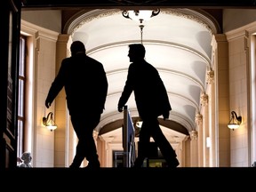 Ontario Premier Doug Ford (left) and Canadian Prime Minister Justin Trudeau make their way to their talks at the Ontario Legislature, in Toronto on Thursday, July 5, 2018.