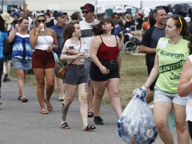 Music fans during opening night at the Ottawa Bluesfest in Ottawa Thursday July 5, 2018. Some fans cooled off inside the War Museum Thursday.  Tony Caldwell
