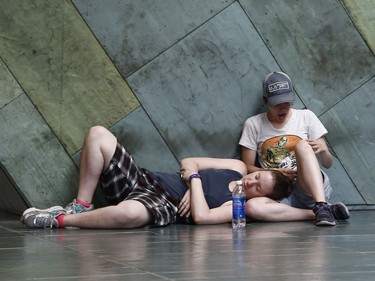 Music fans during opening night at the Ottawa Bluesfest in Ottawa Thursday July 5, 2018. Some fans cooled off inside the War Museum Thursday.  Tony Caldwell