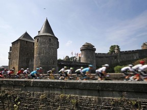 The pack leaves Fougeres, rear, during the seventh stage of the Tour de France cycling race over 231 kilometers (143.5 miles) with start in Fougeres and finish in Chartres, France, France, Friday, July 13, 2018.