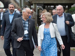Yukon Premier Sandy Silver, Nunavut Premier Joe Savikataaq, Alberta Premier Rachel Notley and Northwest Territories Premier Bob McLeod, left to right, arrive for a meeting of Canadian premiers and Indigenous leaders at Le Pays de la Sagouine, a recreated historic Acadian village, in Bouctouche, N.B. on Wednesday, July 18, 2018.