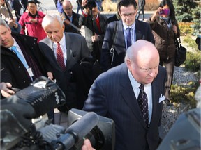 Sen. Mike Duffy leaves the Ottawa court house in Ottawa Tuesday April 7,  2015. He's now suing the Senate.