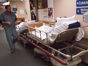 Patients wait in the hallway at the overcrowded Queensway Carleton Hospital in 2016.