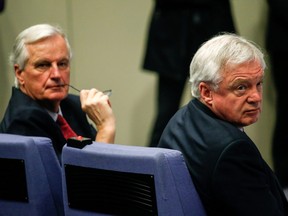 David Davis and Michel Barnier, chief negotiator for the EU, right, sit in the audience during a news conference with U.K Prime Minister Theresa May and European Commission President Jean-Claude Juncker at the European Commission building in Brussels, Belgium, on Friday, Dec. 8, 2017.