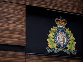 The RCMP logo is seen outside Royal Canadian Mounted Police "E" Division Headquarters, in Surrey, B.C., on April 13, 2018. A former RCMP officer and group spokesman for many Mounties says a former member who reportedly took her life won't be the last if changes aren't made soon. Rob Creasser, of the Mounted Police Professional Association of Canada, says the RCMP has had dozens of opportunities to change its "toxic" culture -- but he places a lot of blame on the federal government.