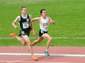 Ridgemont's Joe Fast, left, and Dakota Goguen of Sir William Mulock in Newmarket finished second and first in the boys' junior 3,000 metres of the OFSAA track and field championships. Katherine McColeman photo