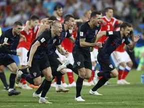 Croatian players celebrate after the winning penalty kick gives them a shootout victory against Russia in Sochi on Saturday.