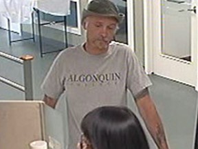 Police are seeking this man as a suspect in two bank robberies on Carling Avenue last Friday.