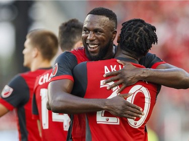 Toronto FC's Ayo Akinola is congratulated by teammate Jozy Altidore, left, after scoring a goal agianst Ottawa Fury FC during the first half of Canadian Championship soccer action in Toronto, Wednesday July 25, 2018.