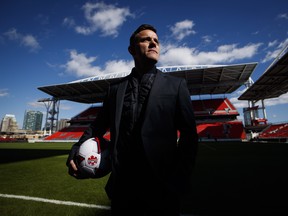 In this Feb. 26 file photo, Canadian men's soccer coach John Herdman poses for a photo at BMO Field in Toronto.