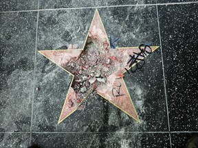 his photo shows Donald Trump's star on the Hollywood Walk of Fame that was vandalized Wednesday, July 25, 2018, in Los Angeles. Los Angeles police Officer Ray Brown said the vandalism was reported early Wednesday and someone was subsequently taken into custody. Authorities said a pickax was used in the vandalism.