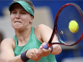 Eugenie Bouchard of Canada returns a ball to Veronika Kudermetova of Russia during their quarter-finals game at the WTA Ladies Championship tennis tournament in Gstaad, Switzerland, Friday, July 20, 2018.