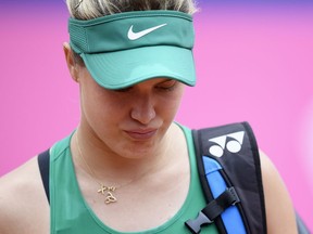 Eugenie Bouchard of Canada leaves the court after giving up during the semi-final game against Alize Cornet of France at the WTA Ladies Championship tennis tournament in Gstaad, Switzerland, Saturday, July 21, 2018.