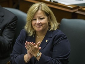 Ontario Minister of Education Lisa Thompson applauds during the Throne speech at Queen's Park Thursday.