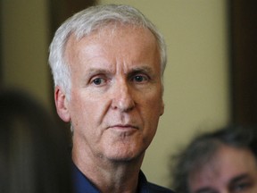 In this Jan. 14, 2015, file photo, movie director James Cameron talks to reporters at an event in Wellington, New Zealand. Filmmaker Cameron is backing a bid announced Tuesday July 24, 2018, by a group of British museums to raise US dollars 20 million (15 million pounds) to buy 5,500 Titanic artefacts from the private American company that salvaged them from the wreck of the passenger liner RMS Titanic.