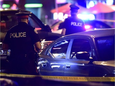 Police work at the scene of a mass casualty incident in Toronto on Sunday, July 22, 2018.