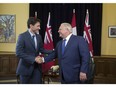 They look happy enough here: Prime Minister Justin Trudeau meets with Ontario Premier Doug Ford at Queen's Park in Toronto on July 5. Already, the two governments disagree. Stan Behal/Toronto Sun/Postmedia Network