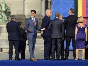 Prime Minister Justin Trudeau takes part in the family photo at Place du Cinquantenaire during the NATO Summit in Brussels, Belgium, on Wednesday, July 11, 2018.