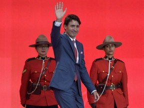 Prime Minister Justin Trudeau waves during the Canada Day noon hour show on Parliament Hill in Ottawa on Saturday, July 1, 2017.