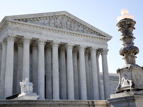 The Supreme Court is seen Monday, July 9, 2018, in Washington. President Donald Trump is expected to announce his choice on a replacement for retiring Supreme Court Justice Anthony Kennedy Monday evening.