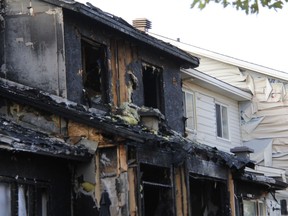 The charred remains of homes after the Barrhaven fire on Thursday, July 12, 2018.