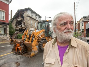 Ovidio Sbrissa, owner of the building with a collapsed wall on Wellington Street near the corner of Rosemount, waits to hear what the outcome will be following an inspection by officials.