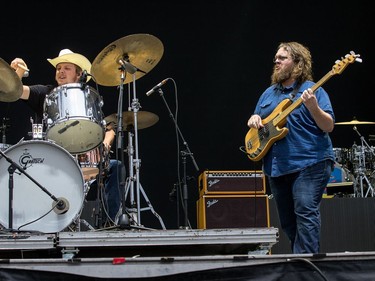 Sturgill Simpson band members Miles Miller on drums, and Chuck Bartels on bass guitar, perform on the City Stage. Wayne Cuddington/Postmedia